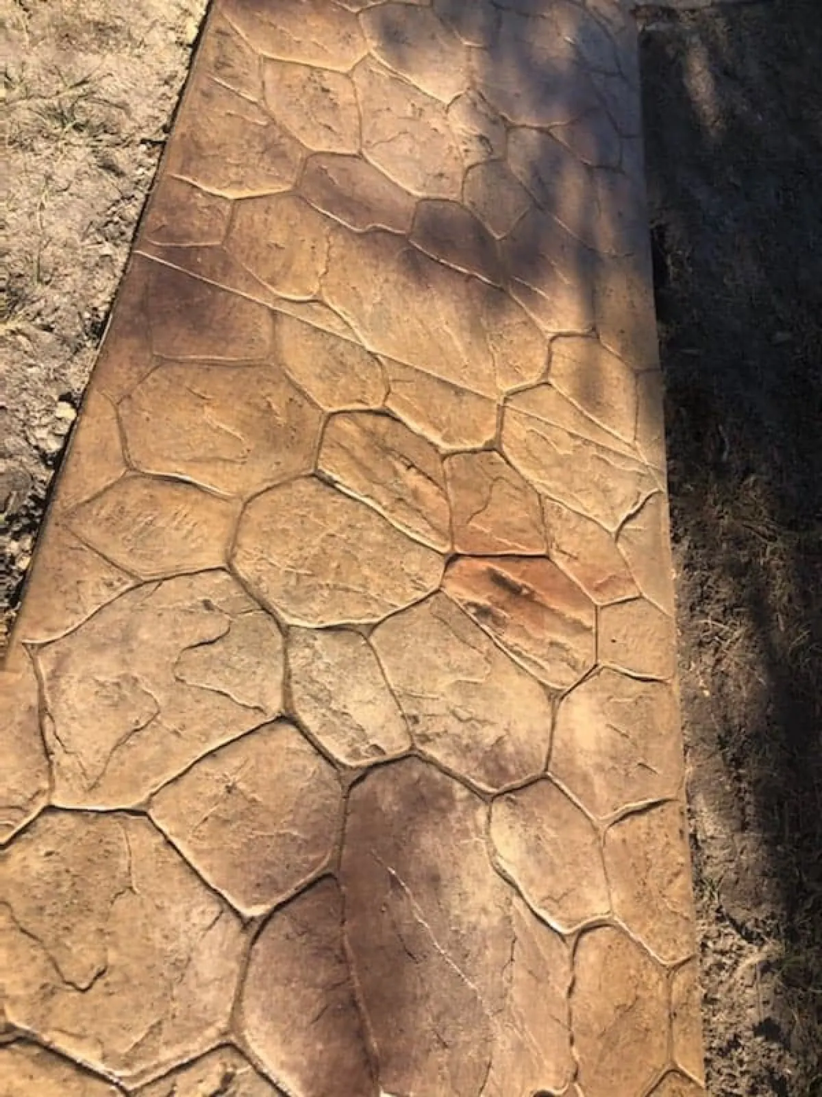 Tan flagstone pattern stamped concrete path in Brevard County