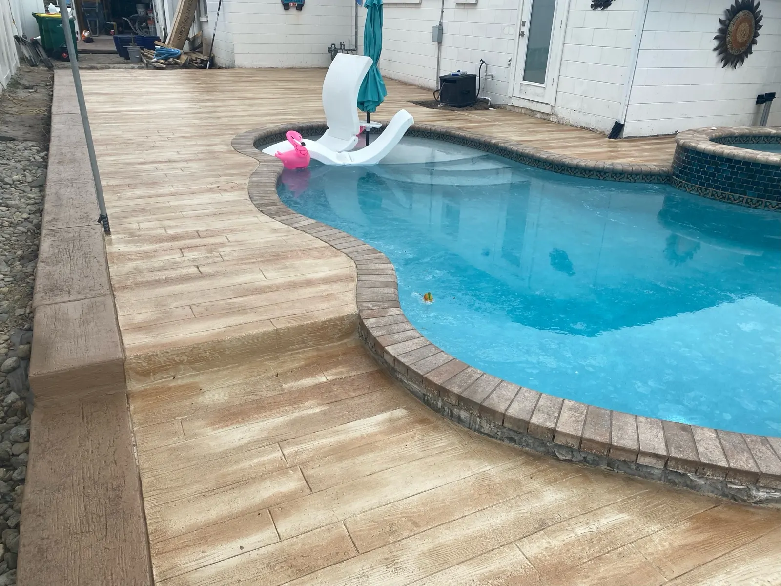 Stamped concrete pool deck in Palm Bay, FL by Slab & Stone